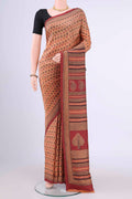 Cinnamon Printed Silk Saree with Printed design on the body and Thread Border displayed on a mannequin