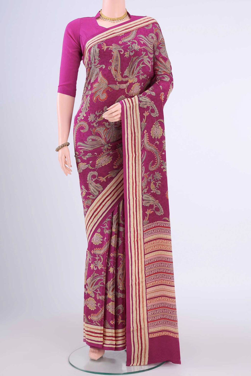 Magenta Mysore Crepe Saree with Printed design on the body and Plain Border displayed on a mannequin