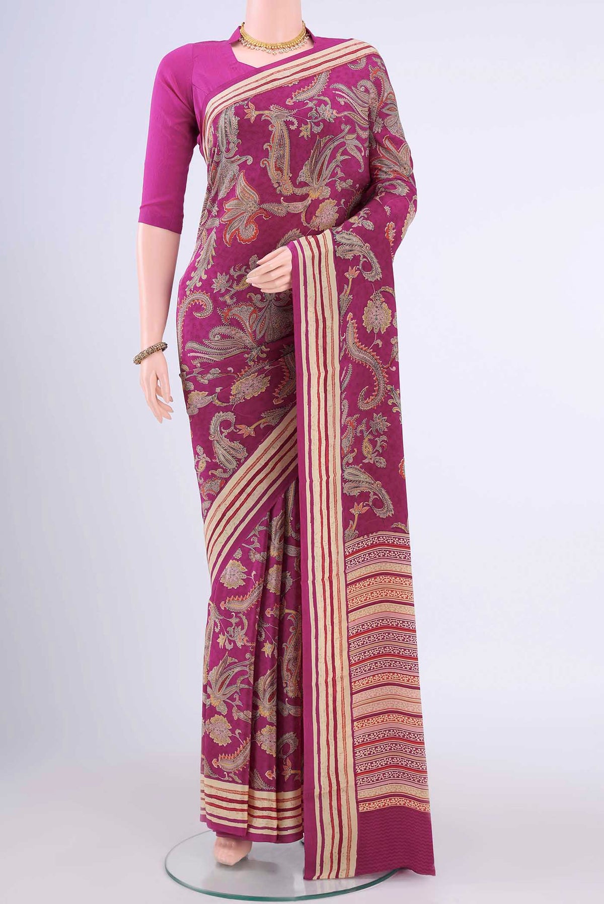 Magenta Mysore Crepe Saree with Printed design on the body and Plain Border displayed on a mannequin
