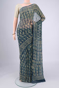 Indigo Mysore Chiffon Saree with Batik Print on the body and Printed Border.  displayed on a mannequin