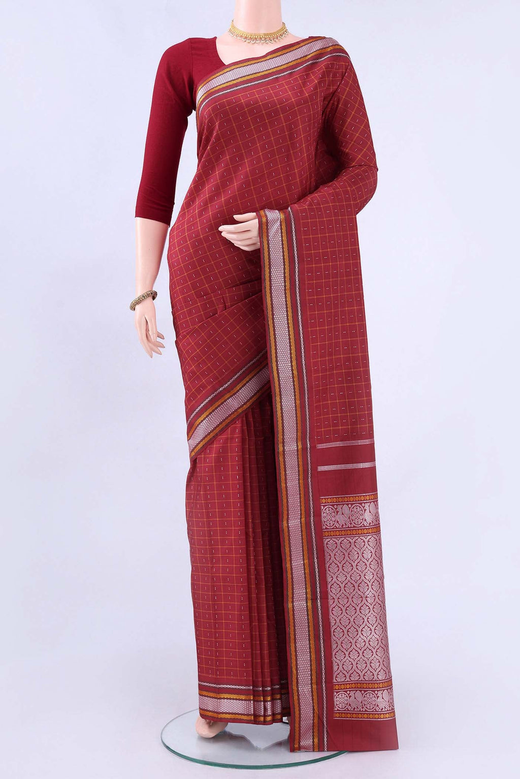Red Kanchipuram Saree Checked design on the body and Thread Border displayed on a mannequin