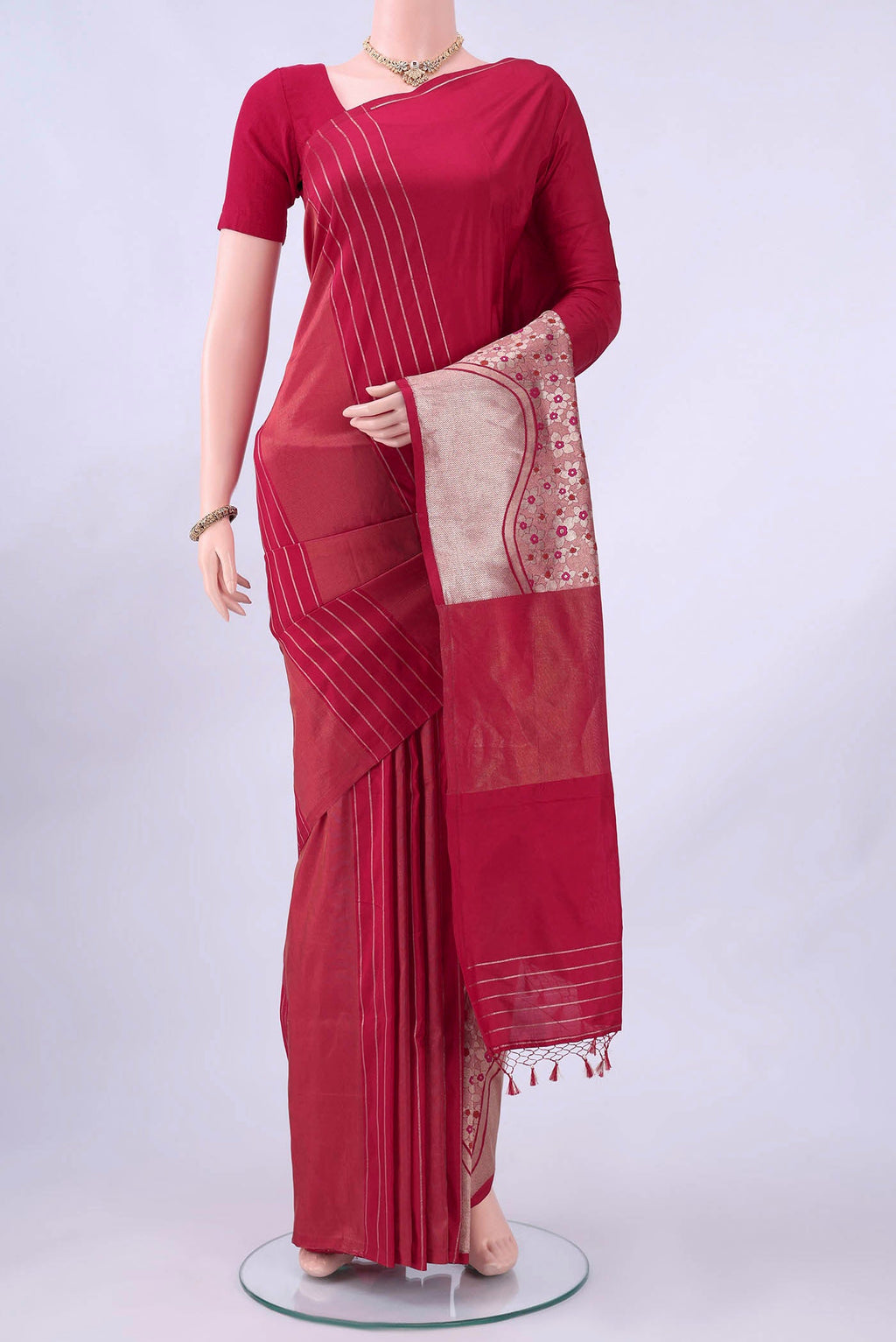 Maroon Banarasi Silk Saree with Zari Butta on the body and Zari Border displayed on a mannequin