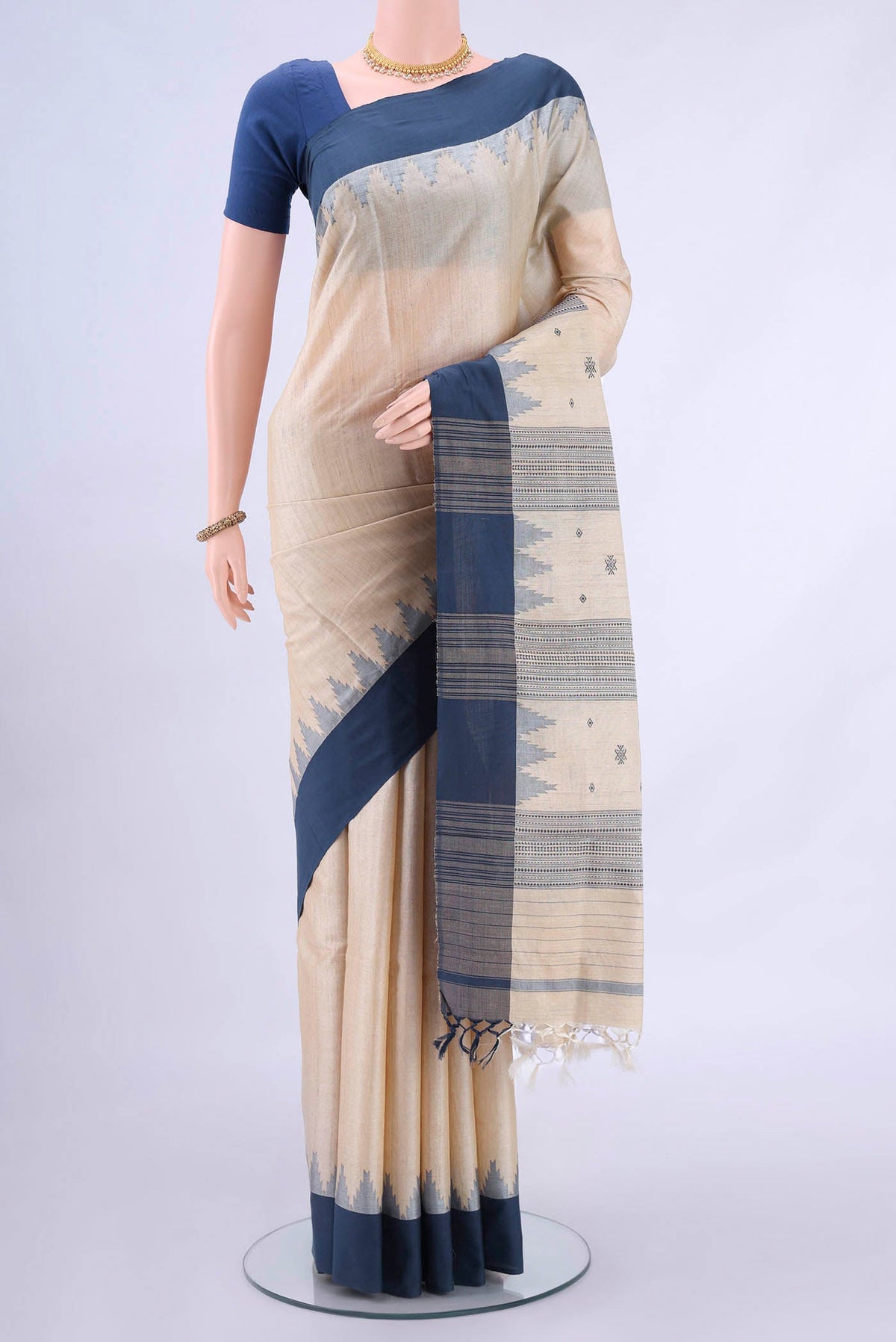 Beige MP Tussar Saree with Plain Body and Plain Border displayed on a mannequin