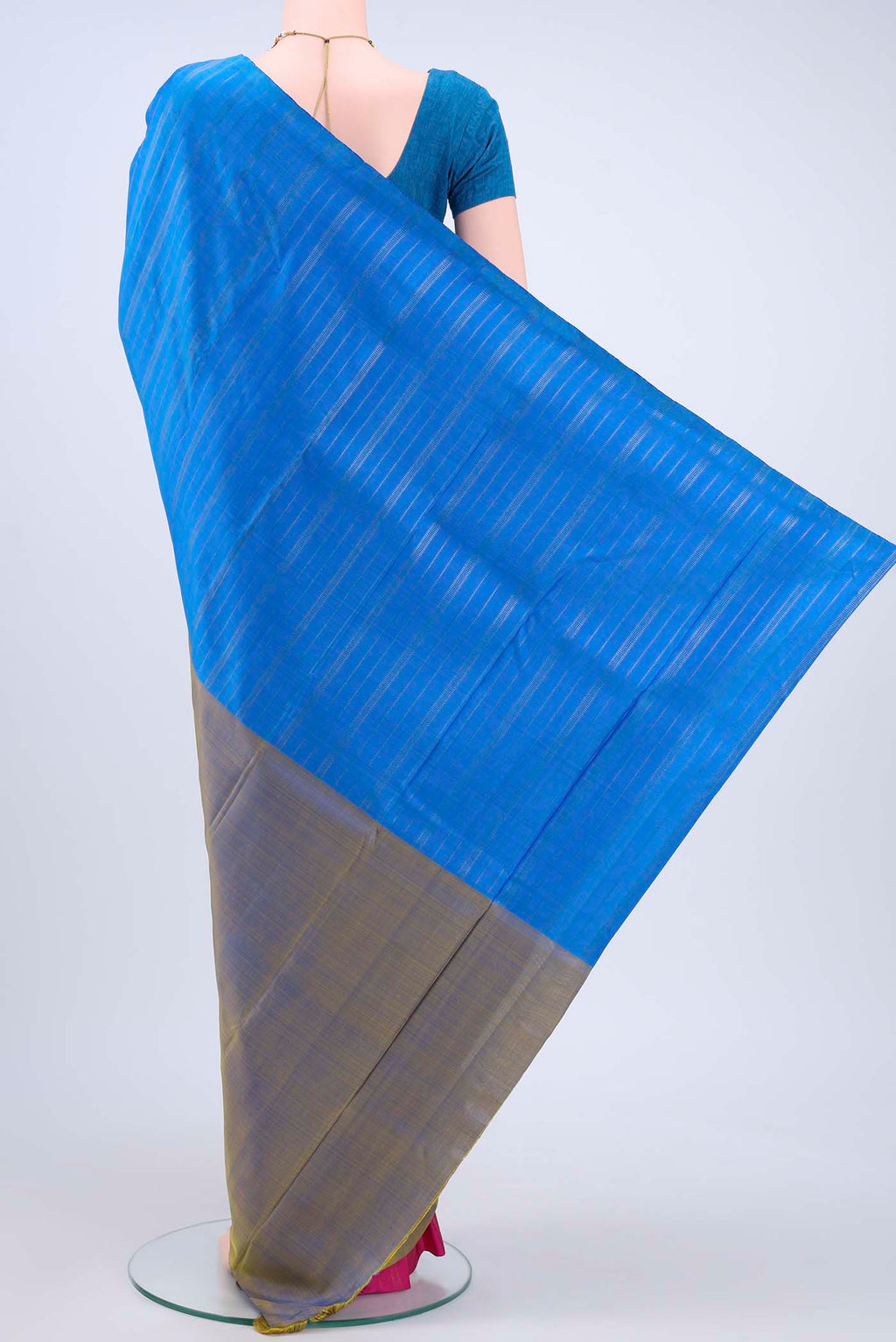 Flat view of Blue Kanchipuram Saree with Zari Butta on the body and Zari Border