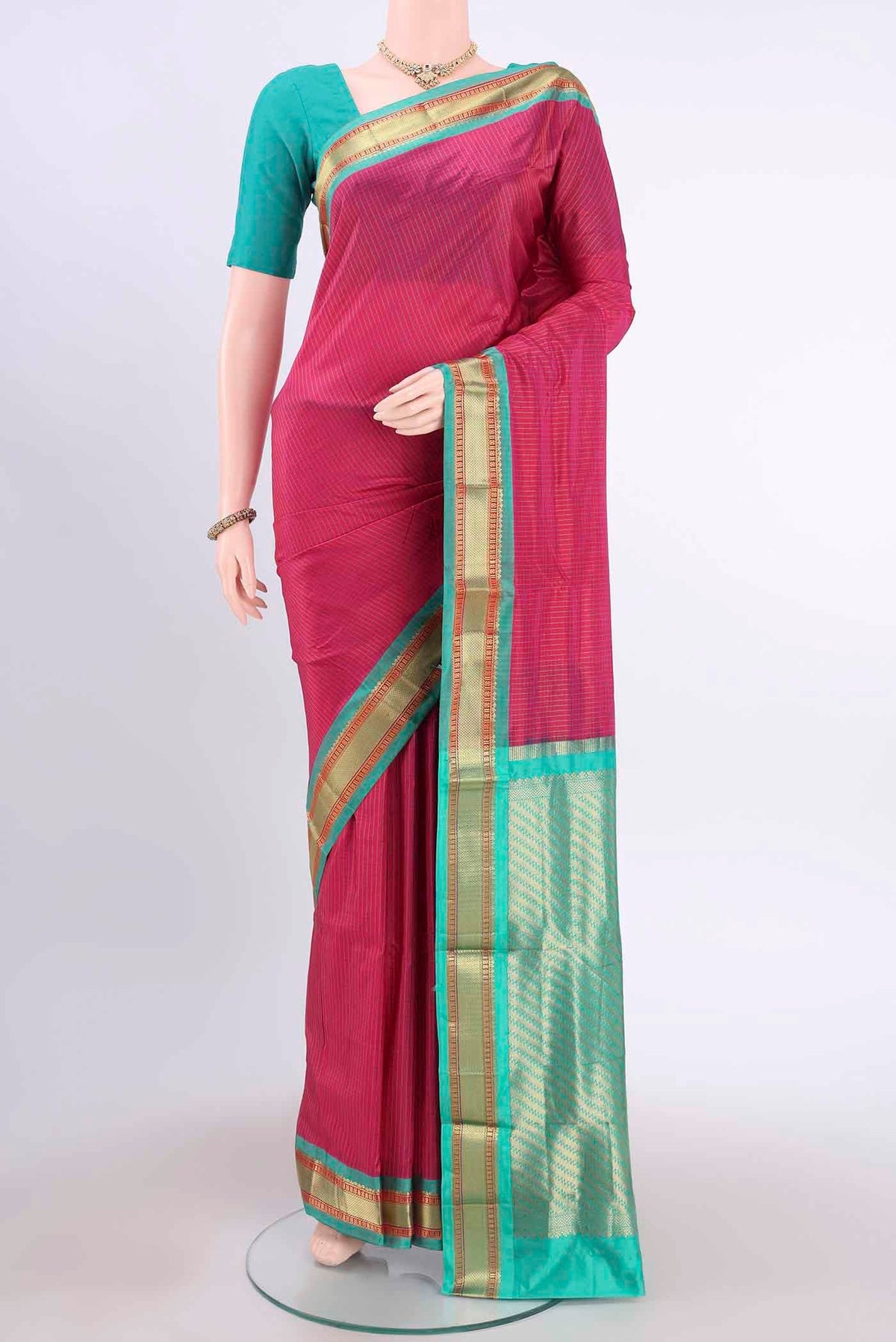 Pink Narayanpet Silk Saree with Checked design on the body and Zari Border displayed on a mannequin