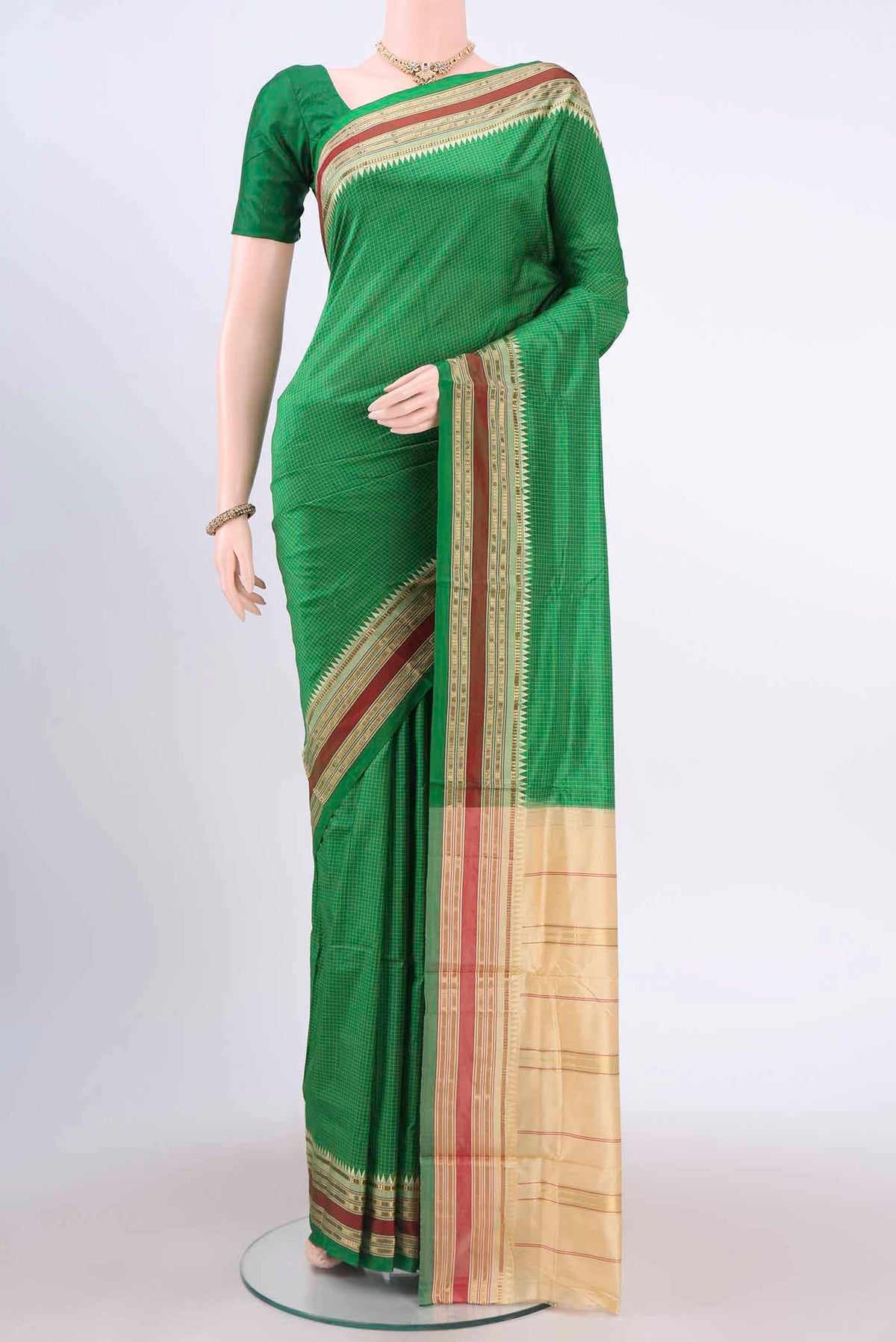 Green Narayanpet Silk Saree with Checked design on the body and Zari Border displayed on a mannequin