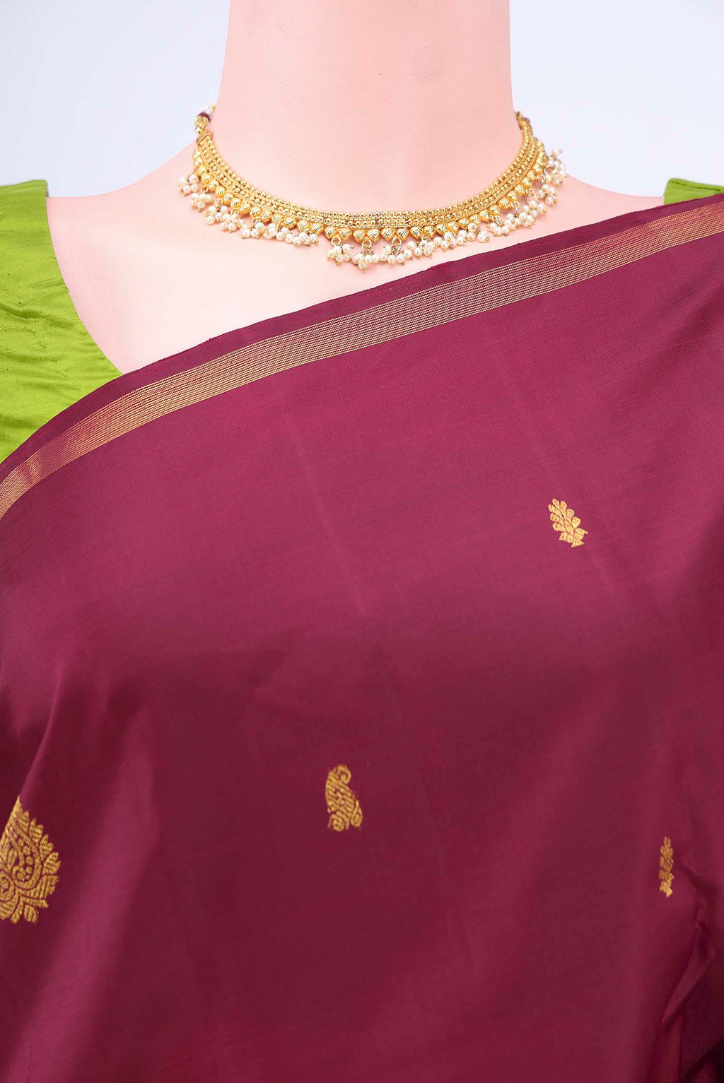 Border image of Maroon Kanchipuram Saree with Zari Butta on the body and Zari Border