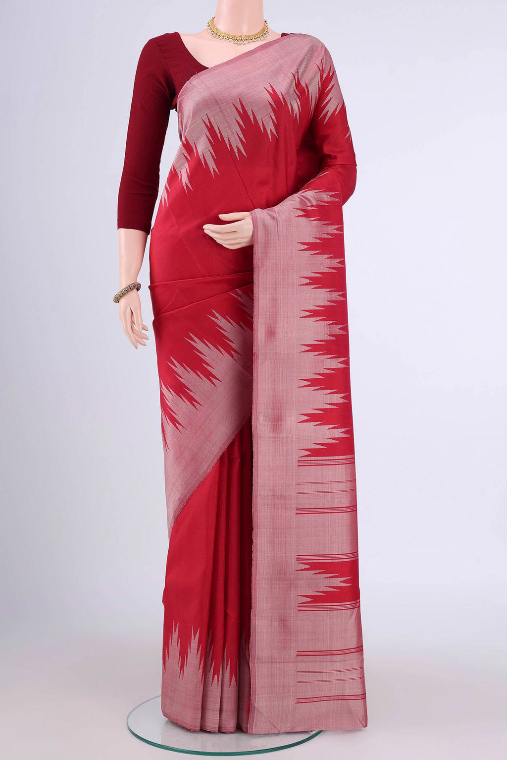 Red Kanchipuram Silk Saree with Plain Body and Temple Border displayed on a mannequin