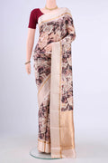 Rose Gold Printed Silk Saree with Printed design on the body and Zari Border displayed on a mannequin