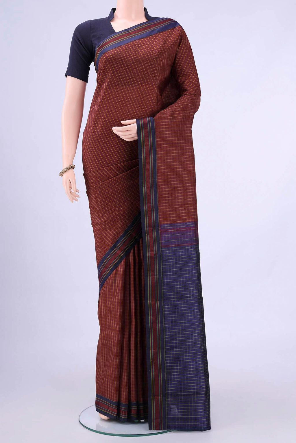 Maroon Kanchipuram Saree with Checked design on the body and Thread Border displayed on a mannequin