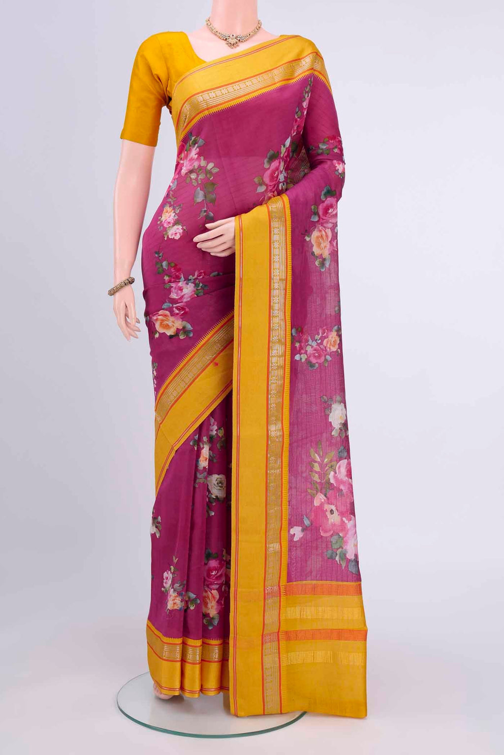 Rani Pink Chanderi Silk Cotton Saree with Floral Print on the body and Zari Border displayed on a mannequin