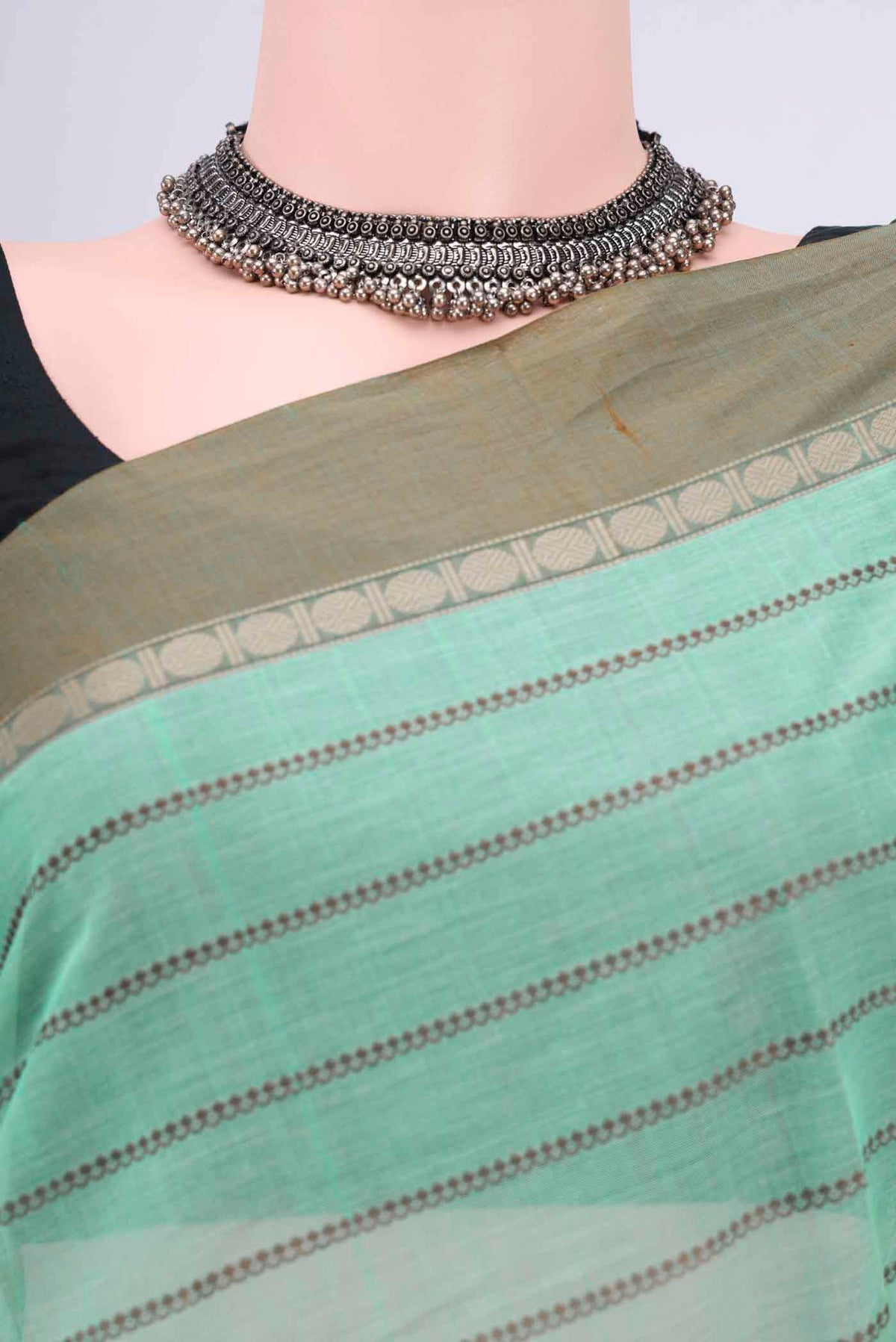 Border image of Mint Green Kanchi Cotton Saree with Stripes on the body and Thread Border