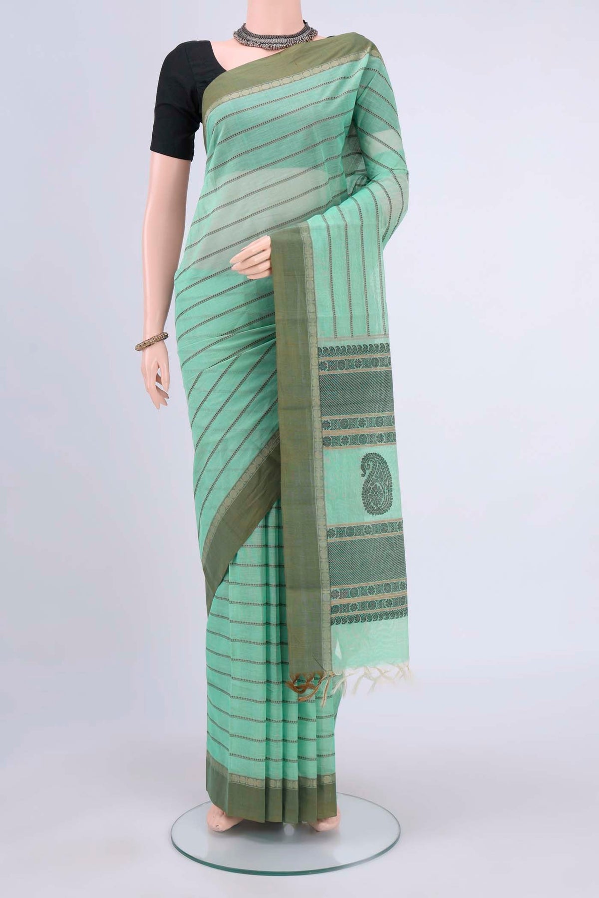 Mint Green Kanchi Cotton Saree with Stripes on the body and Thread Border displayed on a mannequin