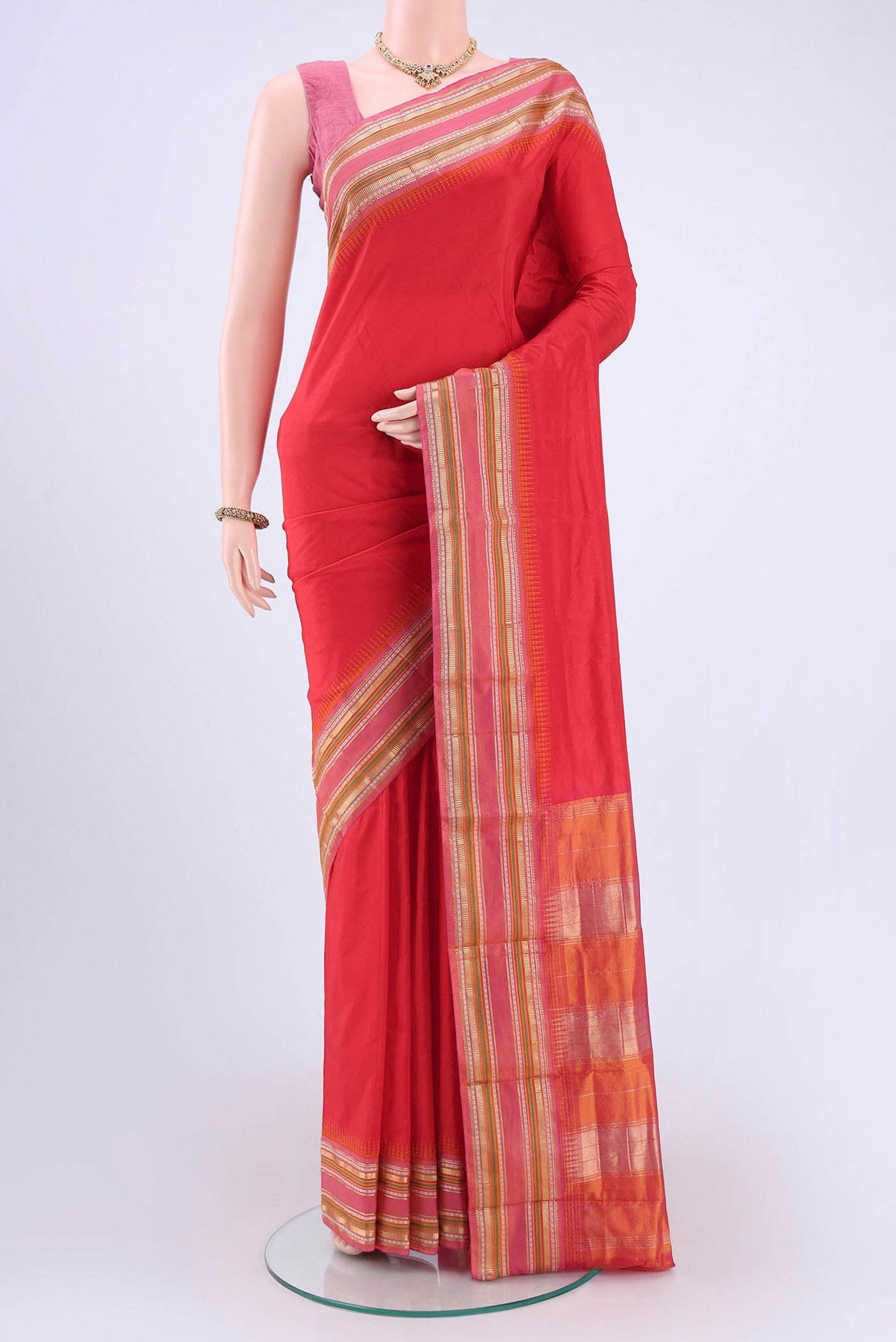 Red Bangalore Silk - kadyal Saree with Plain Body and Zari Border displayed on a mannequin