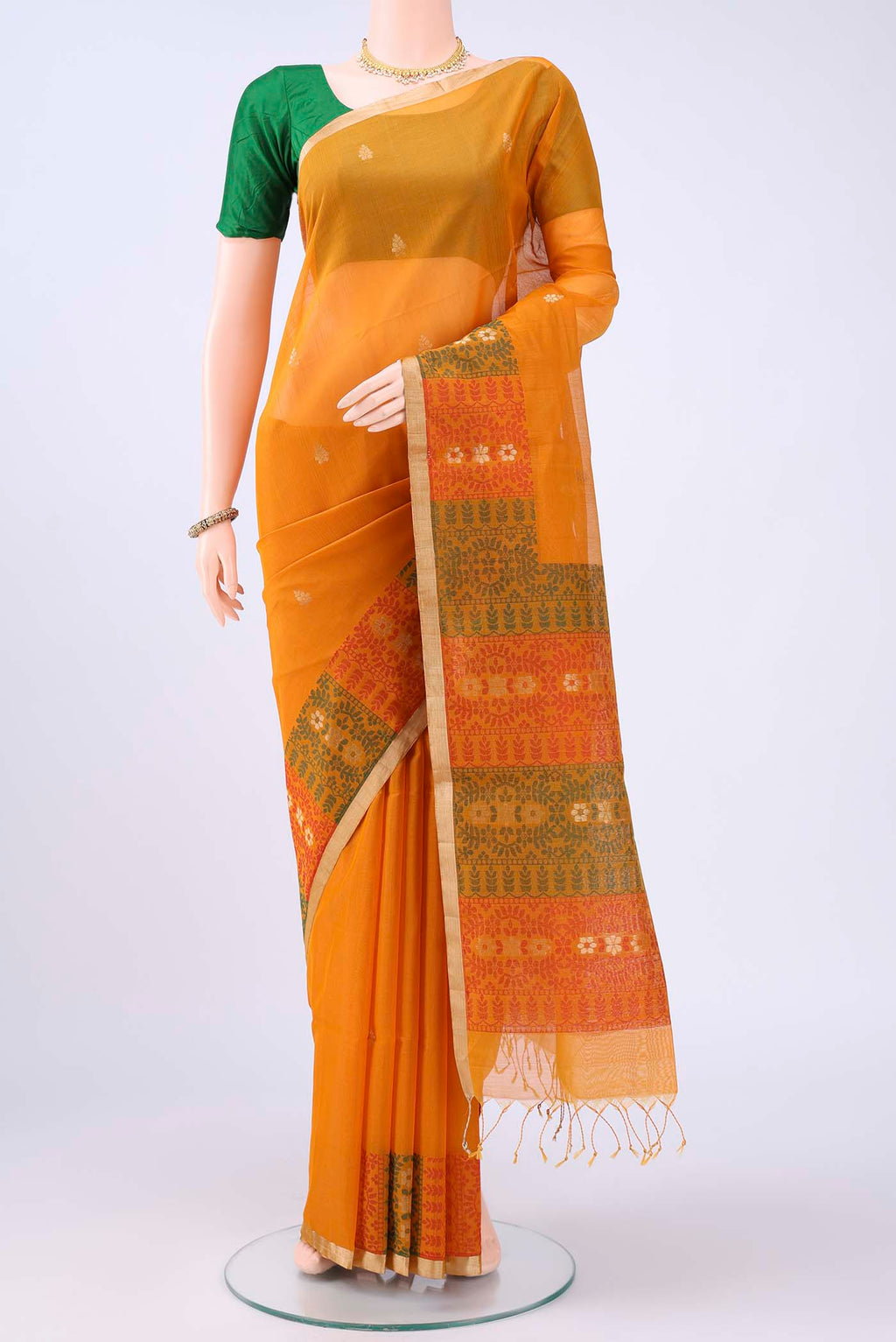 Mustard Kota Cotton Saree with Zari Butta on the body and Zari Border displayed on a mannequin