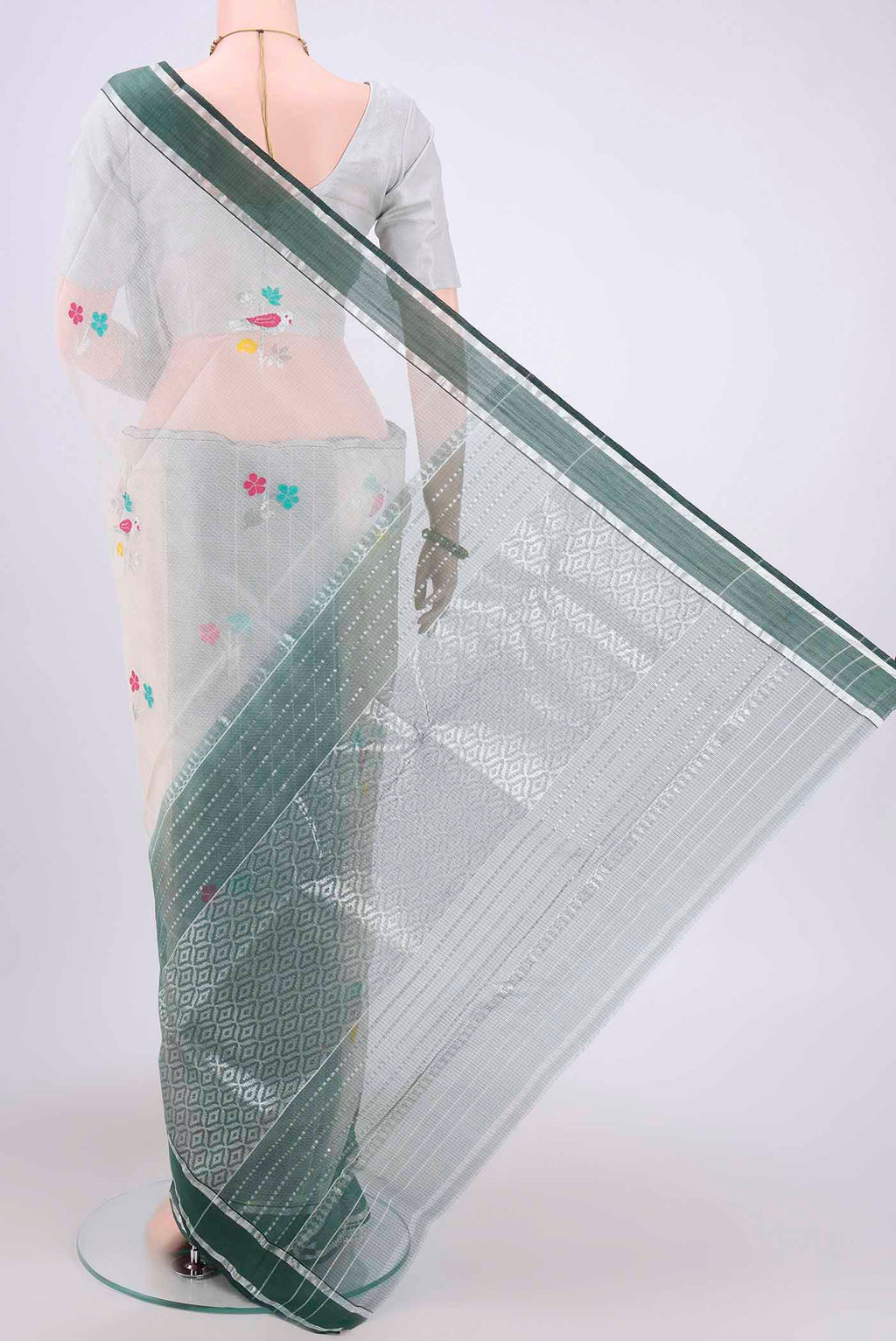 Flat view of Pure Silk Pure Zari Off White Kota Cotton Saree with Zari And Thread Butta on the body and Zari Border. 
