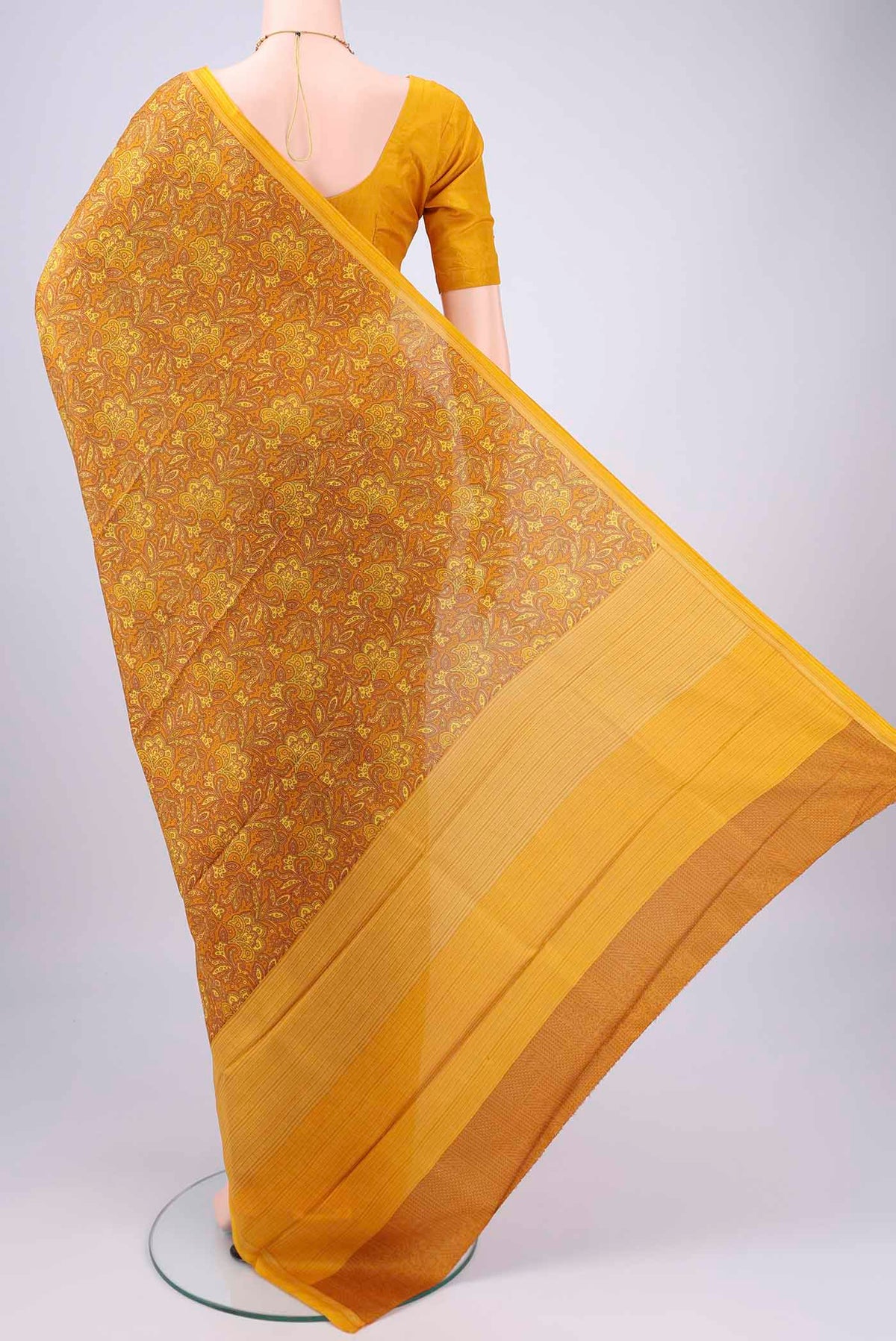 Flat view of Mustard Printed Silk Saree with Floral Print on the body and Printed Border. 