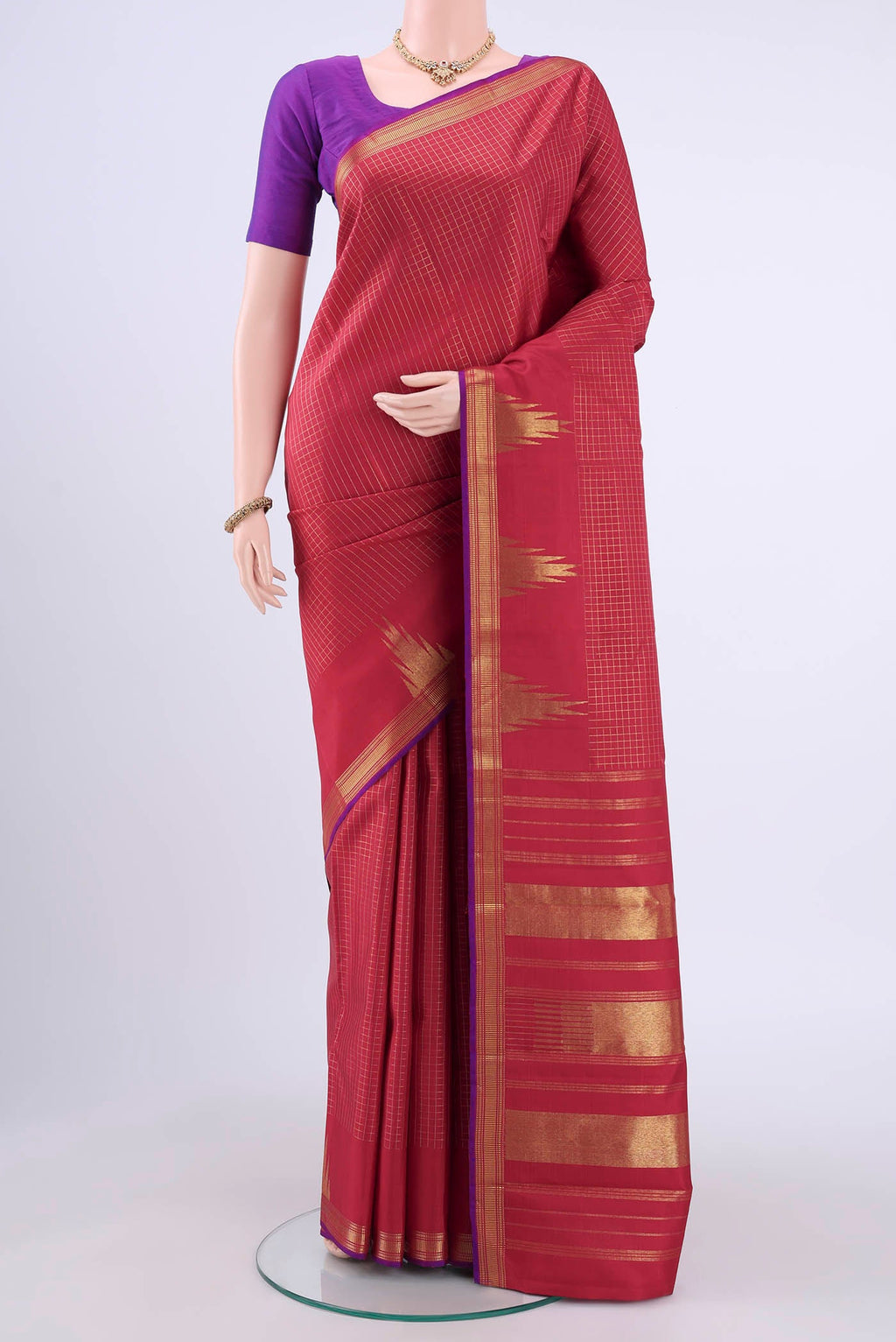 Maroon Kanchipuram Silk Saree with Checked design on the body and Temple Border displayed on a mannequin