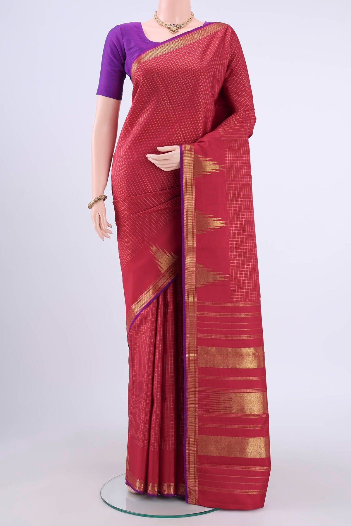 Maroon Kanchipuram Silk Saree with Checked design on the body and Temple Border displayed on a mannequin