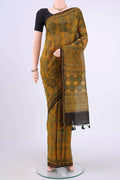 Mustard Cotton Saree with Printed design on the body and Zari Border displayed on a mannequin