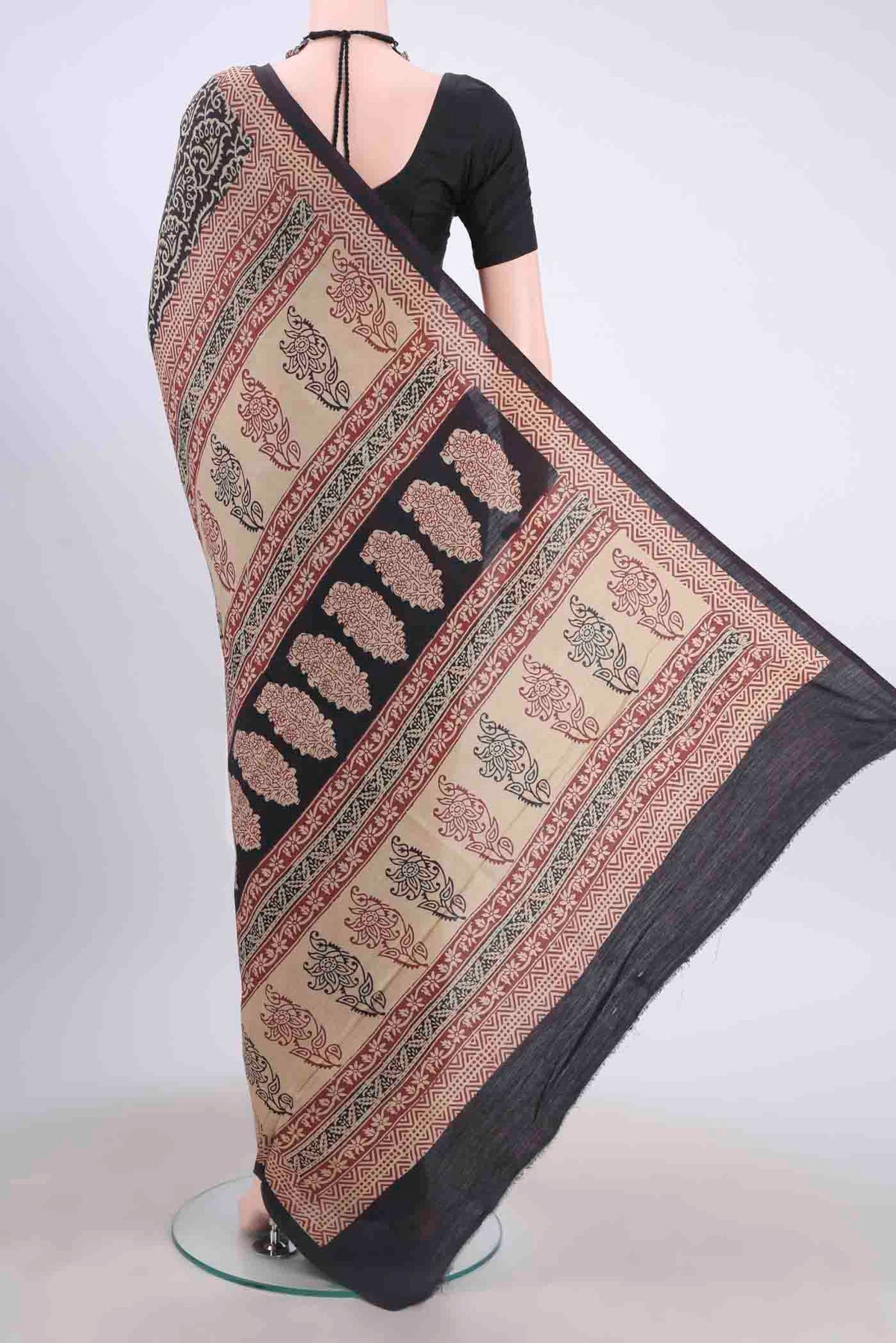 Flat view of Black Tussar Silk Saree with Printed design on the body and Printed Border
