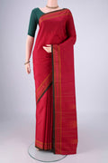 Maroon Kanchipuram Silk Saree with Thread Butta on the body and Thread Border.  displayed on a mannequin