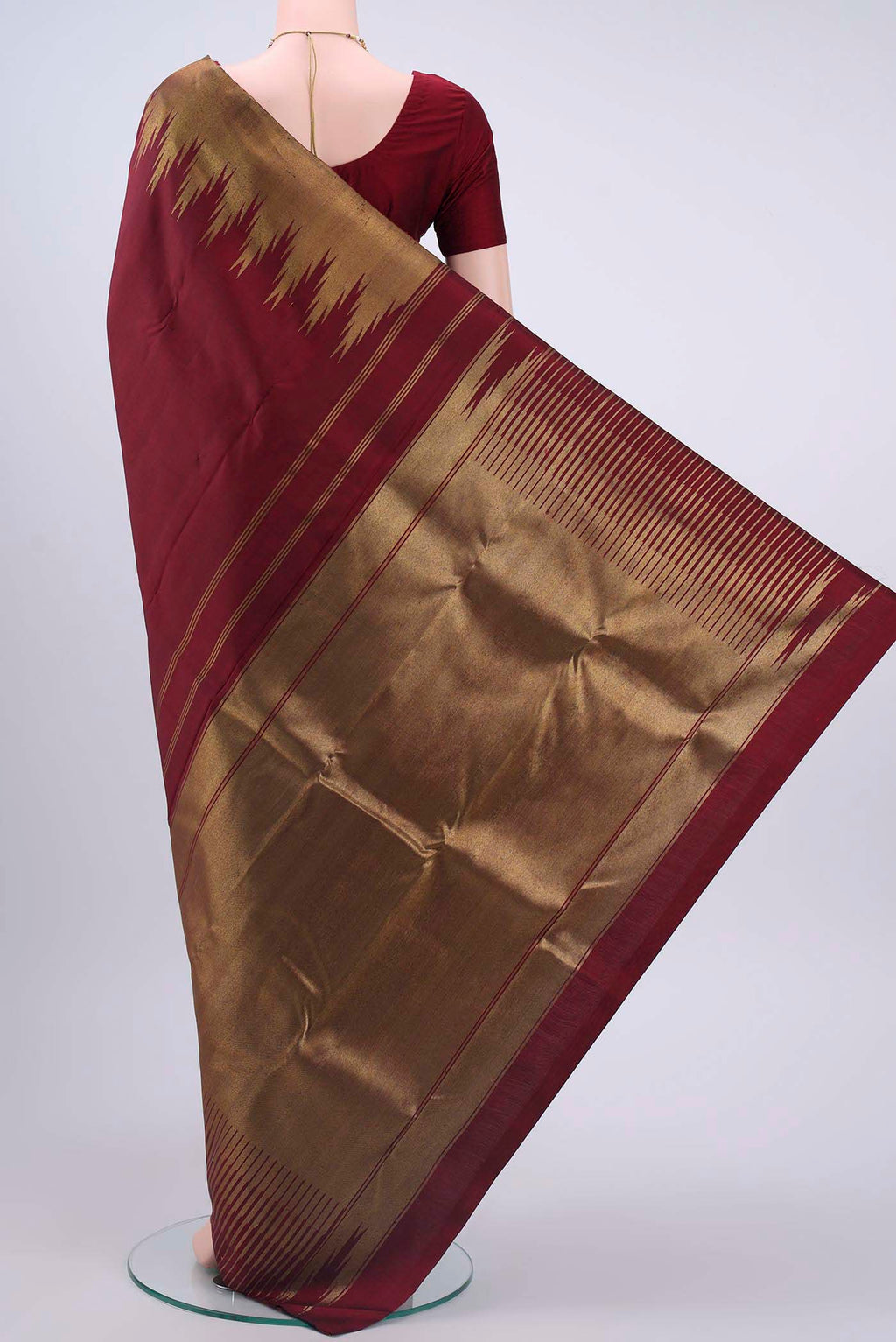 Flat view of Pure Silk Pure Zari Maroon Kanchipuram Saree with Plain Body and Temple Border