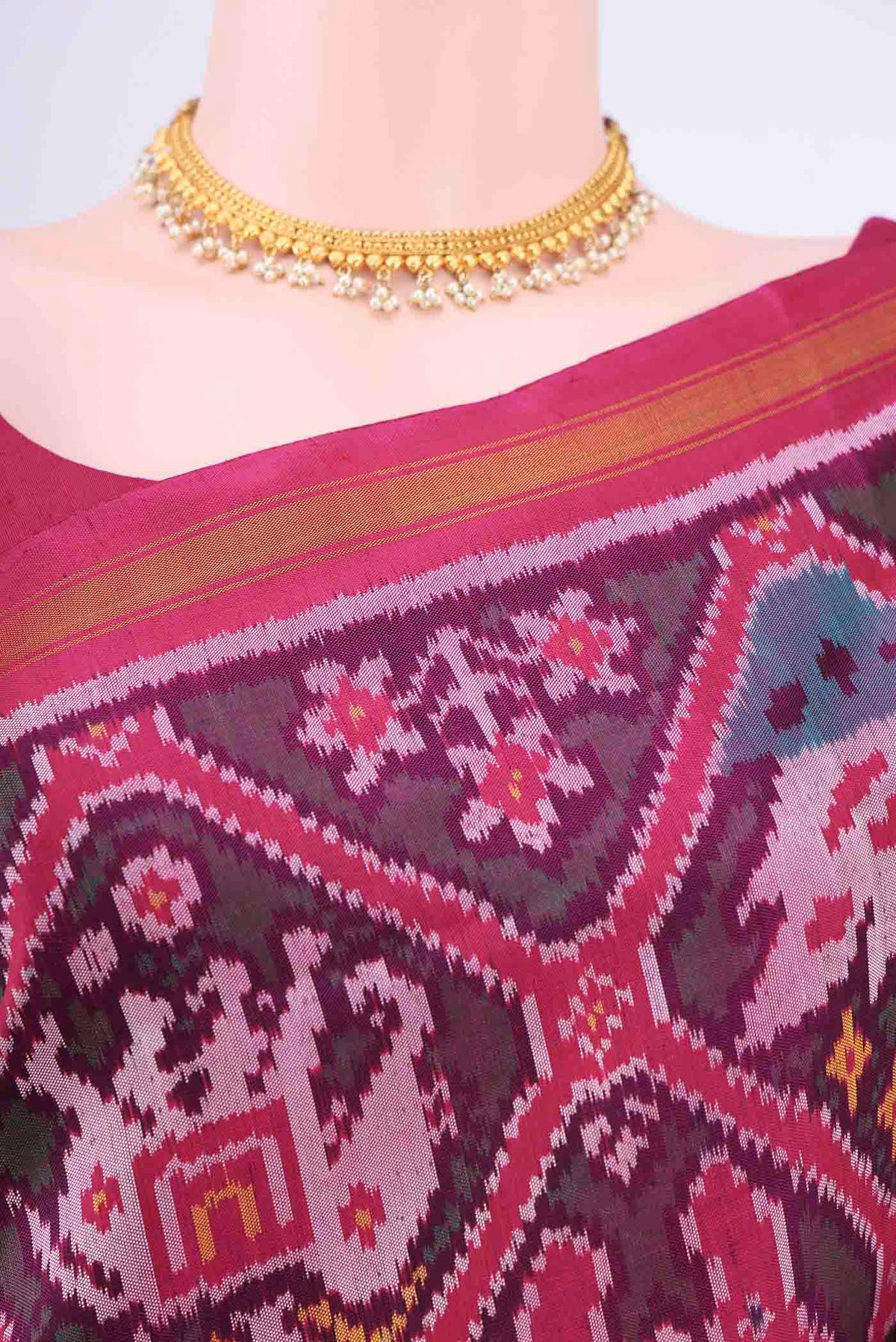 Border image of Purple Rajkot Patola Silk Saree with Ikat design on the body and Zari Border