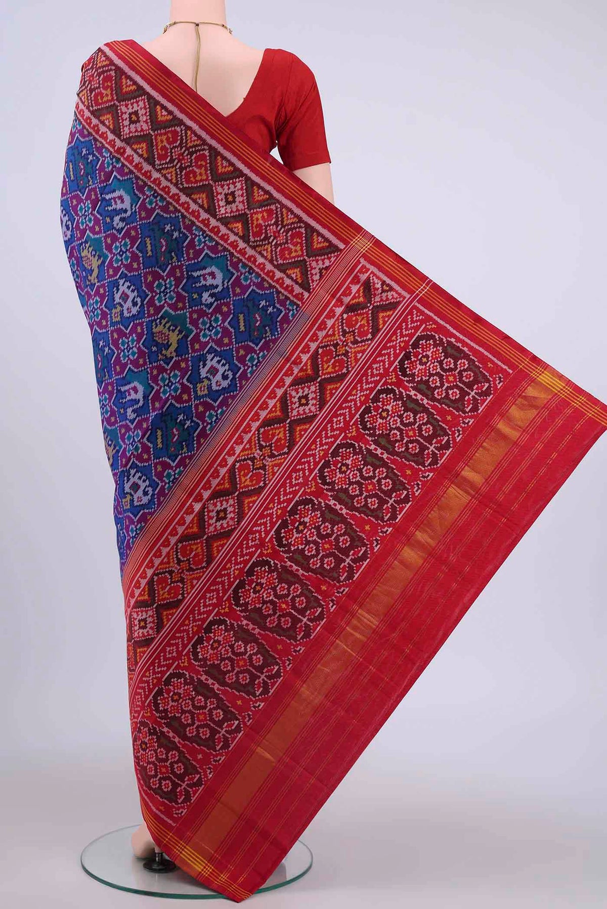 Flat view of Blue Pochampally Silk Saree with Ikat design on the body and Zari Border