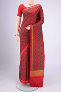 Red Printed Silk Saree with Floral Print on the body and Printed Border.  displayed on a mannequin