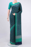 Navy Blue Printed Silk Saree with Printed design on the body and Plain Border.  displayed on a mannequin