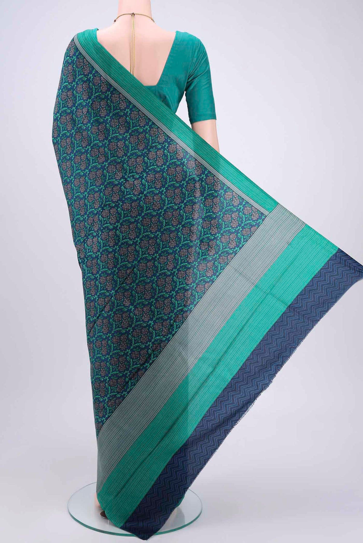 Flat view of Navy Blue Printed Silk Saree with Printed design on the body and Plain Border. 