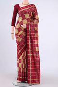 Peach Pochampally Silk Saree with Checked design on the body and Zari Border displayed on a mannequin