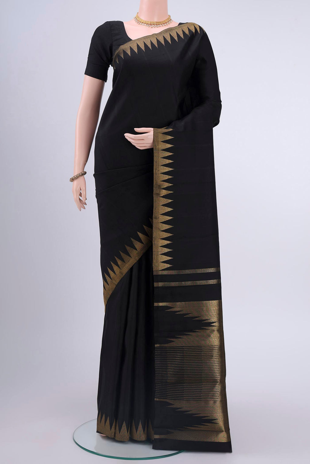 Pure Silk Pure Zari Black Kanchipuram Saree with Plain Body and Temple Border displayed on a mannequin