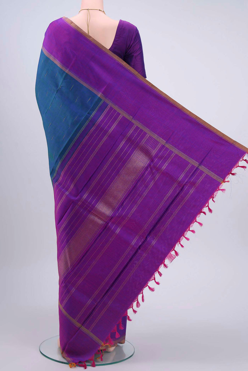 Flat view of Pure Silk Pure Zari Peacock Blue Kanchipuram Saree with Zari Butta on the body and Plain Border