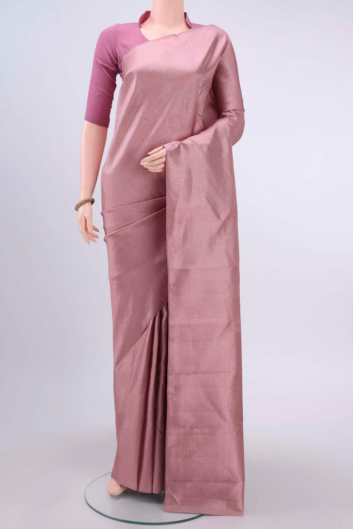 Mauve Kanchipuram Silk Saree with Zari Brocade on the body and Zari Border displayed on a mannequin