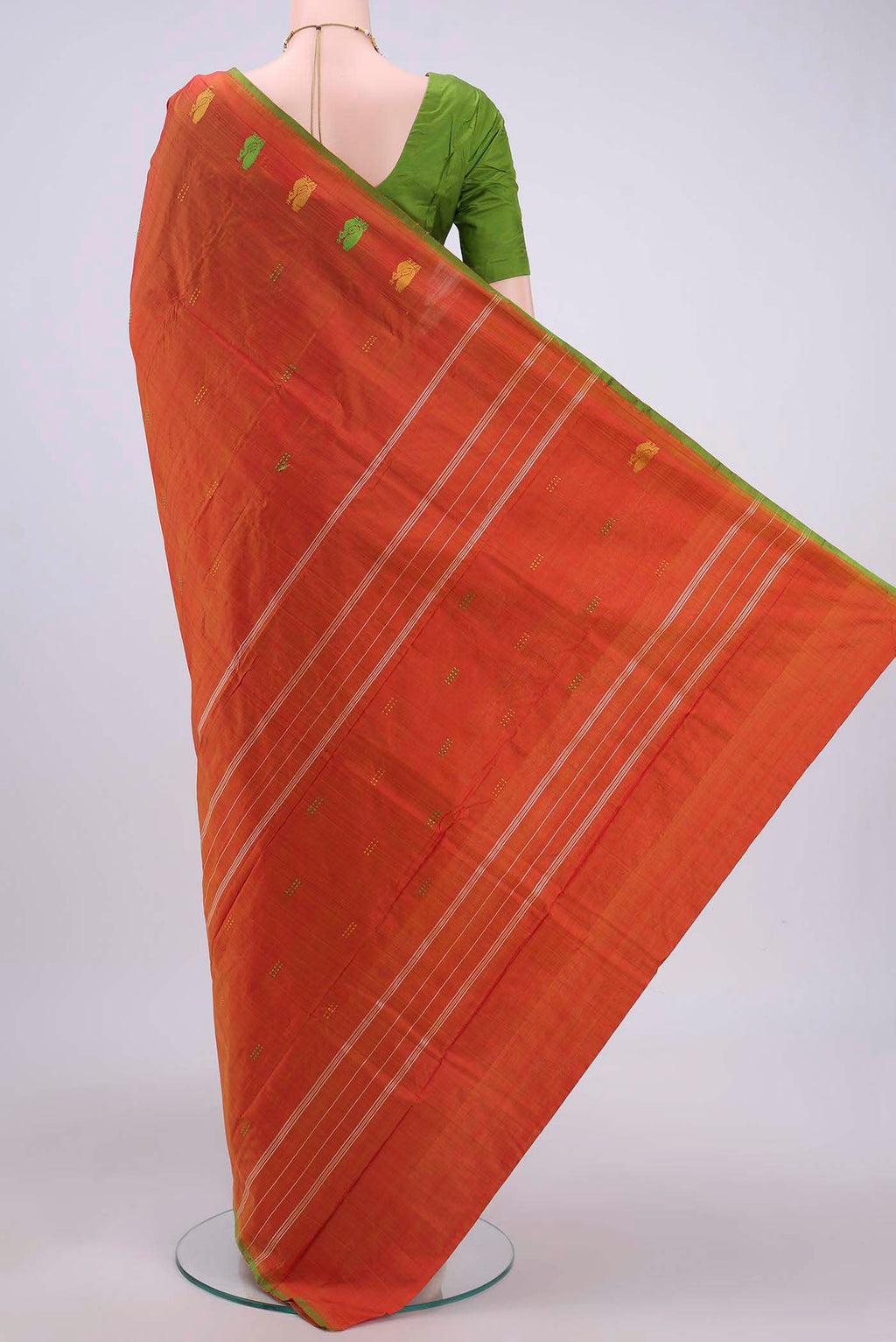 Flat view of Brick Orange Kanchipuram Silk Saree with Thread Butta on the body and Thread Border