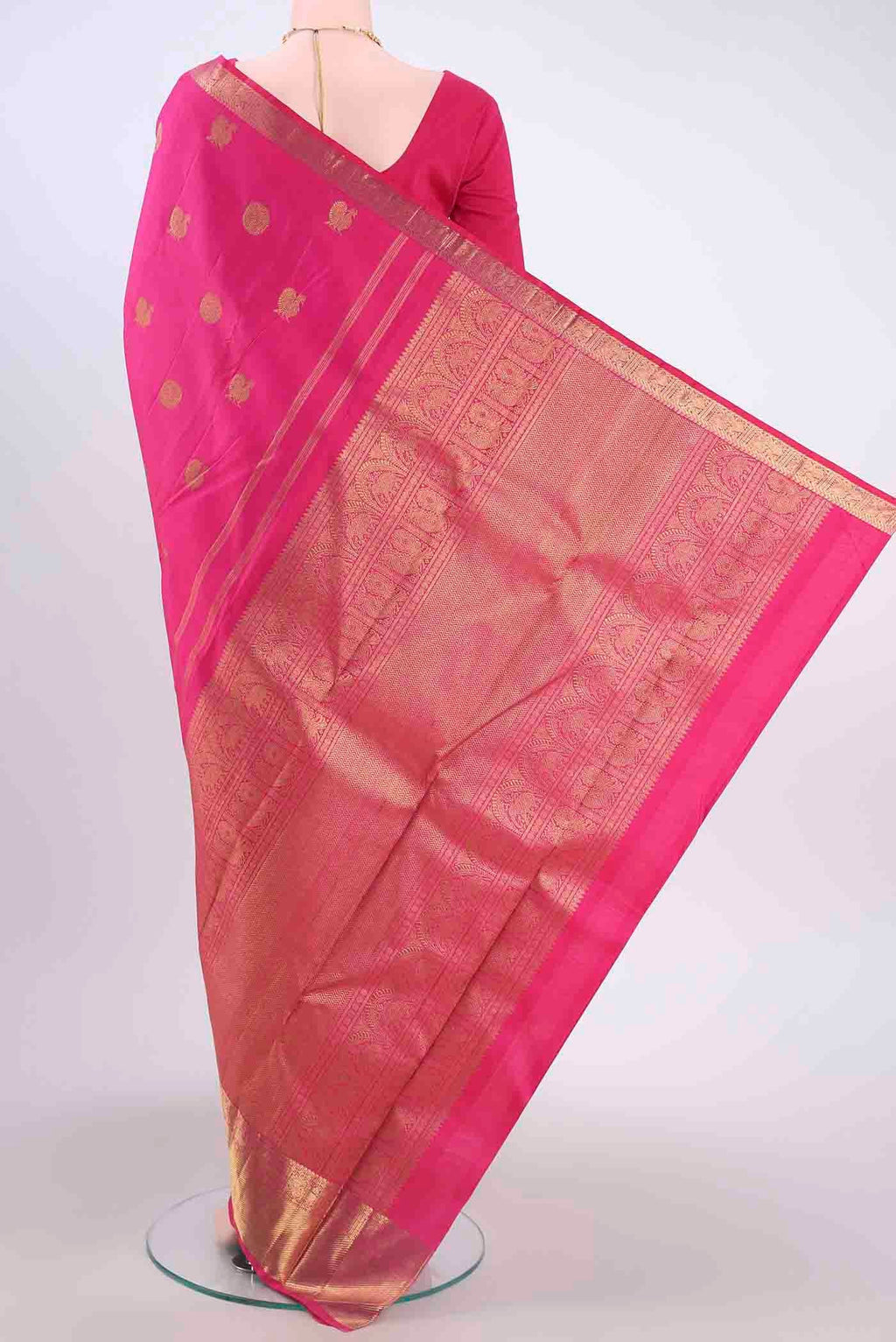 Flat view of Pure Silk Pure Zari Rani Pink Kanchipuram Saree with Zari Butta on the body and Zari Border