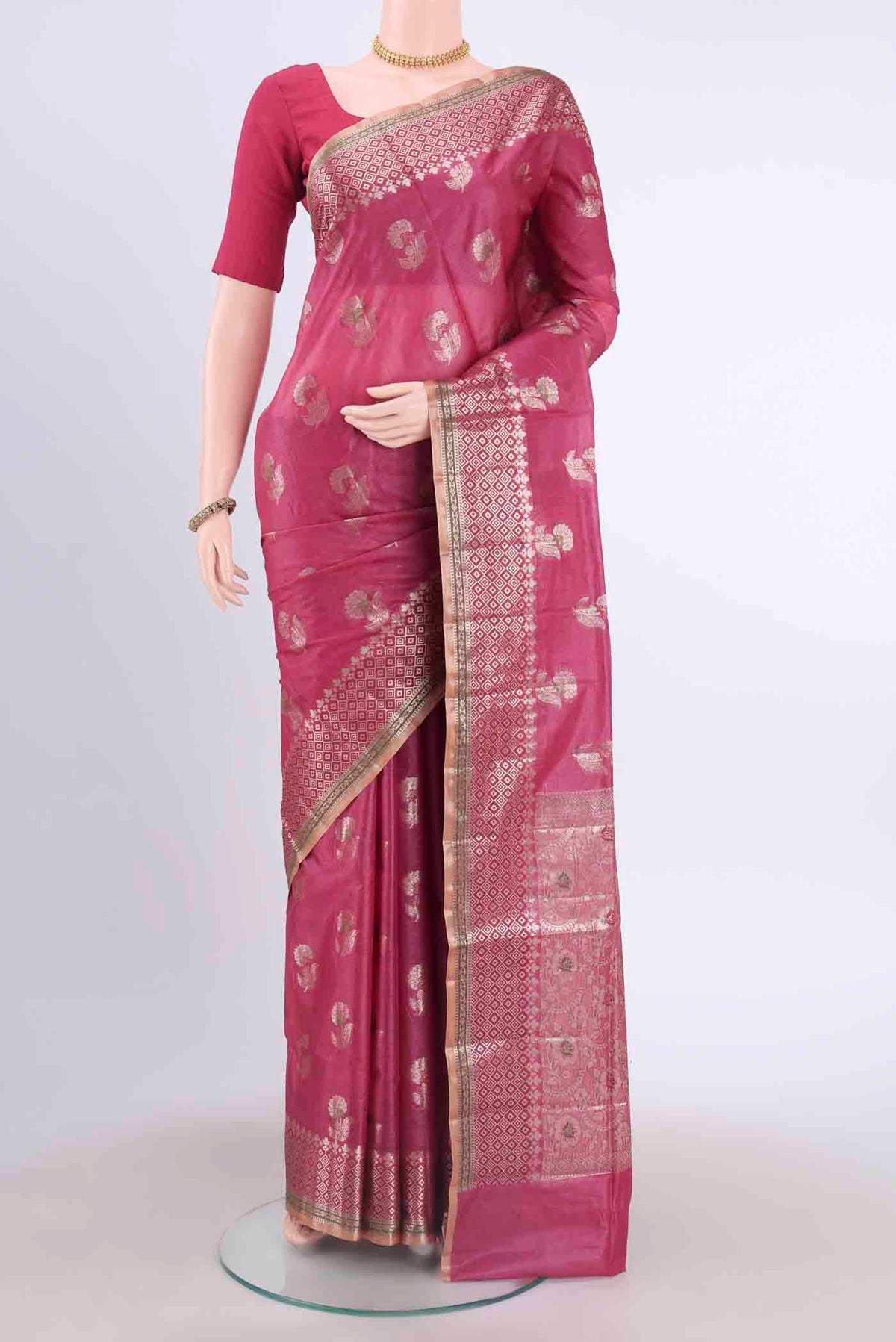 Pink Banarasi Tussar Silk Saree with Zari Butta on the body and Zari And Thread Border displayed on a mannequin