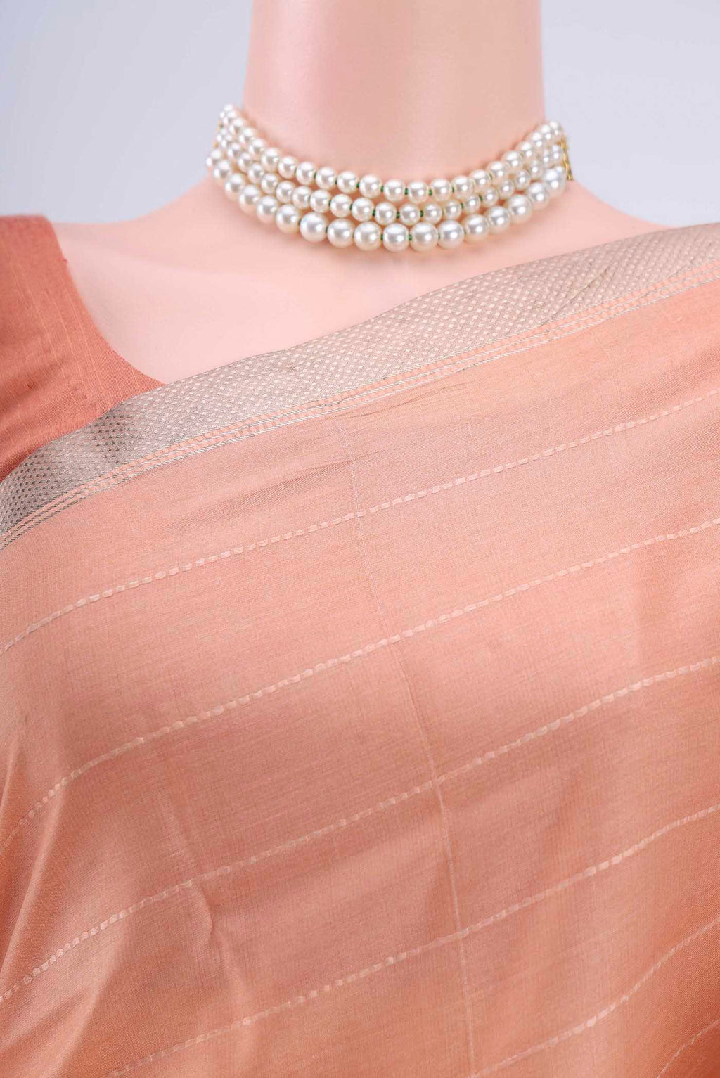 Border image of Peach Tussar Silk Saree with Floral Print on the body and Zari Border