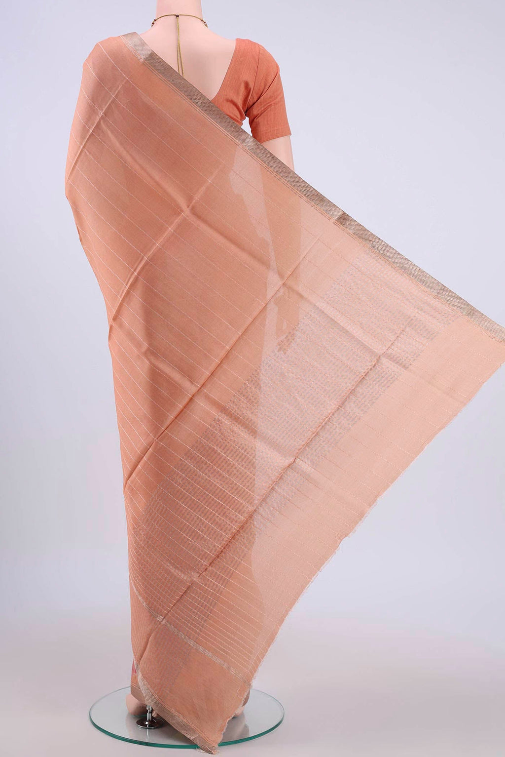Flat view of Peach Tussar Silk Saree with Floral Print on the body and Zari Border