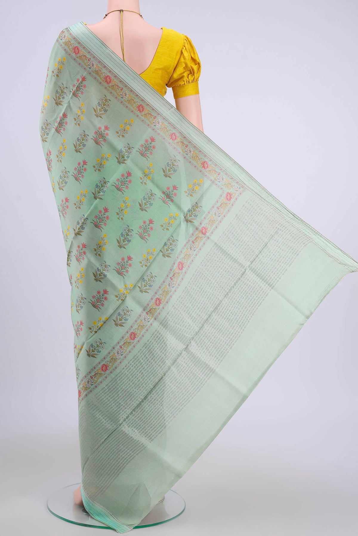 Flat view of Mint Green Tussar Silk Saree with Floral Print on the body and Zari And Thread Border