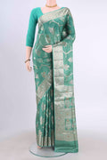 Maya Blue Banarasi Raw Silk Saree with Zari And Thread Butta on the body and Zari And Thread Border displayed on a mannequin