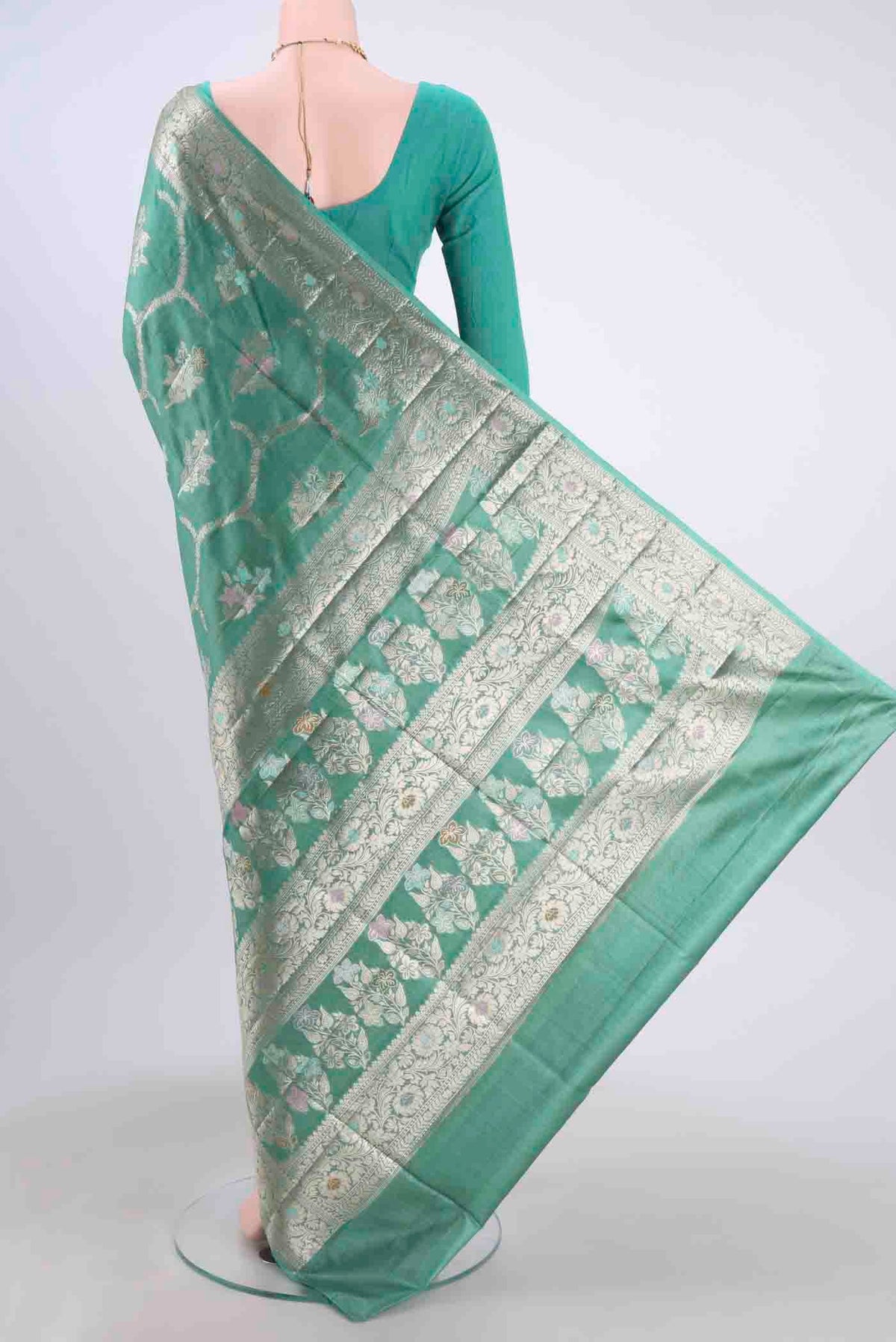 Flat view of Maya Blue Banarasi Raw Silk Saree with Zari And Thread Butta on the body and Zari And Thread Border