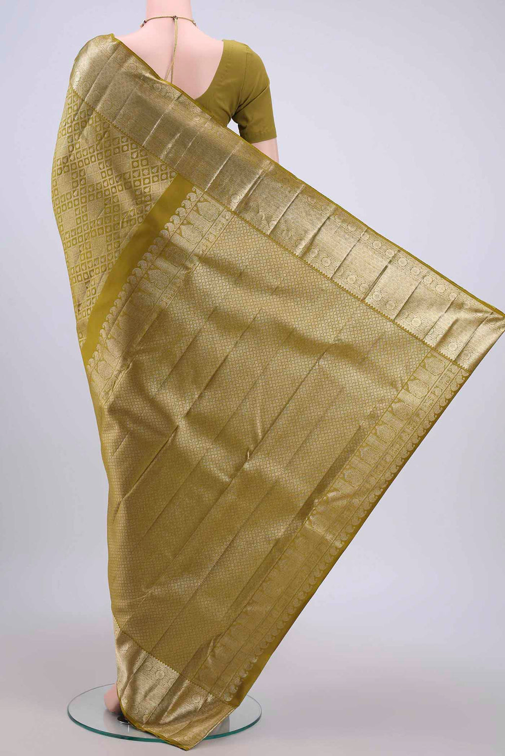 Flat view of Light Green Kanchipuram Silk Saree with Zari Brocade on the body and Zari Border