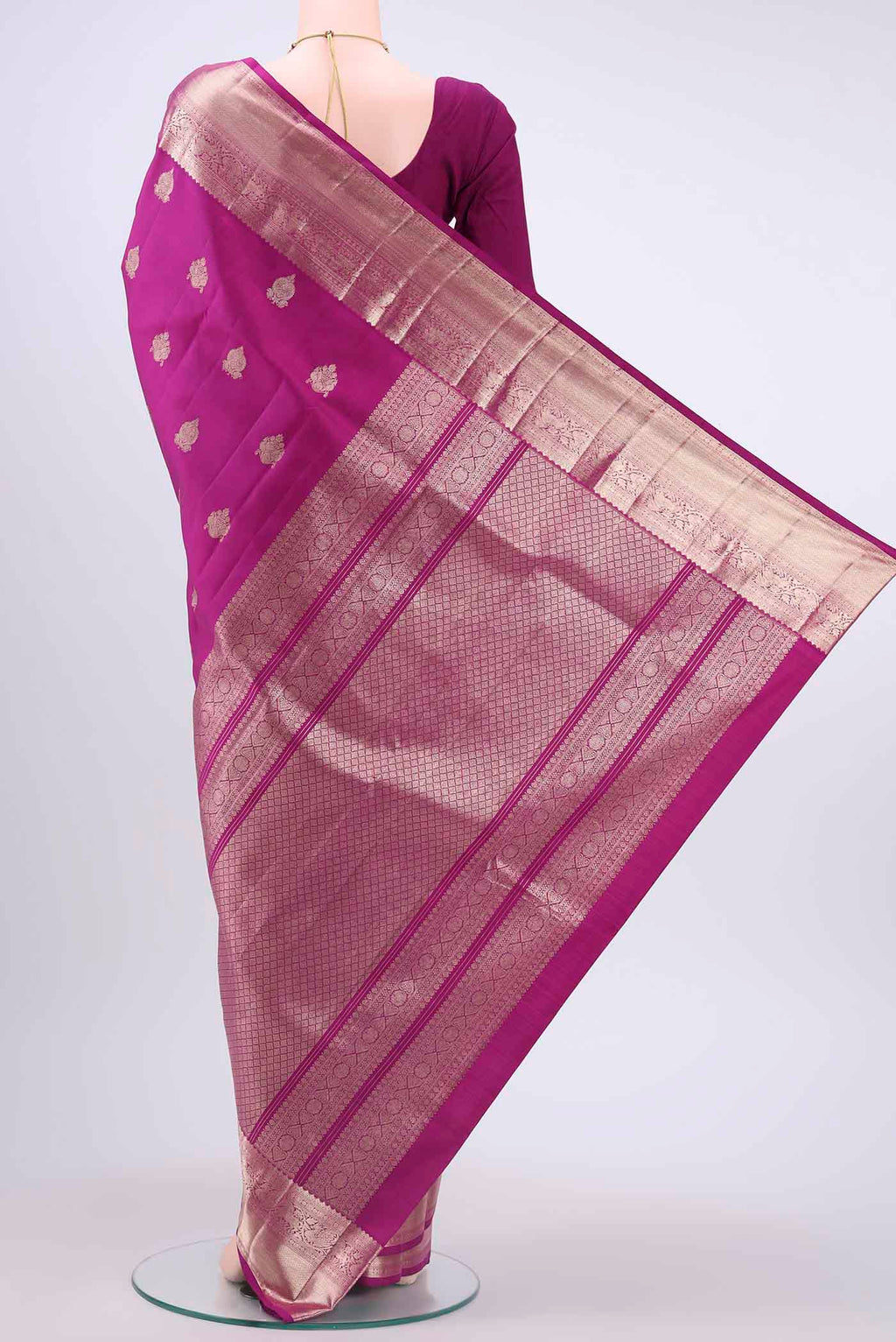 Flat view of Magenta Kanchipuram Silk Saree with Zari Butta on the body and Zari Border