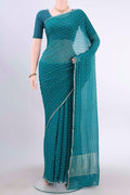 Turquoise Mysore Chiffon Saree with Checked design on the body and Thin Zari Line displayed on a mannequin