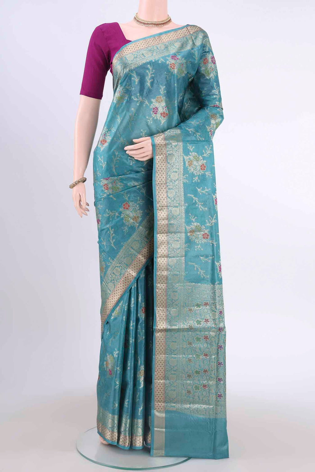 Blue Banarasi Tussar Silk Saree with Zari And Thread Butta on the body and Zari And Thread Border displayed on a mannequin