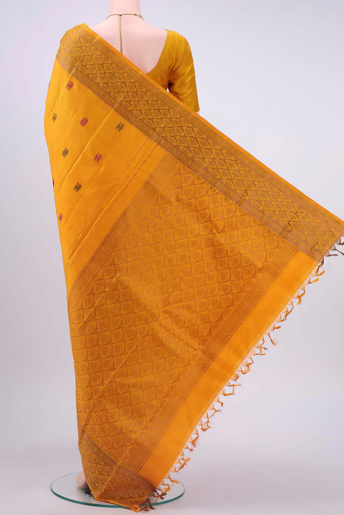 Flat view of Pure Silk Pure Zari Mustard Kanchipuram Saree with Thread Butta on the body and Thread Border
