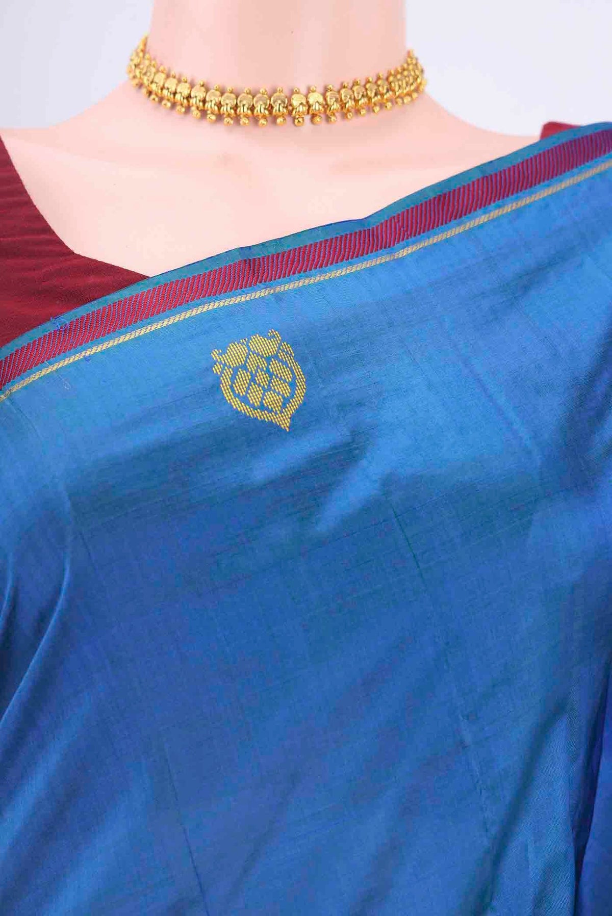 Border image of Peacock Blue Dual Tone Kanchipuram Silk Saree with Plain Body and Zari And Thread Border